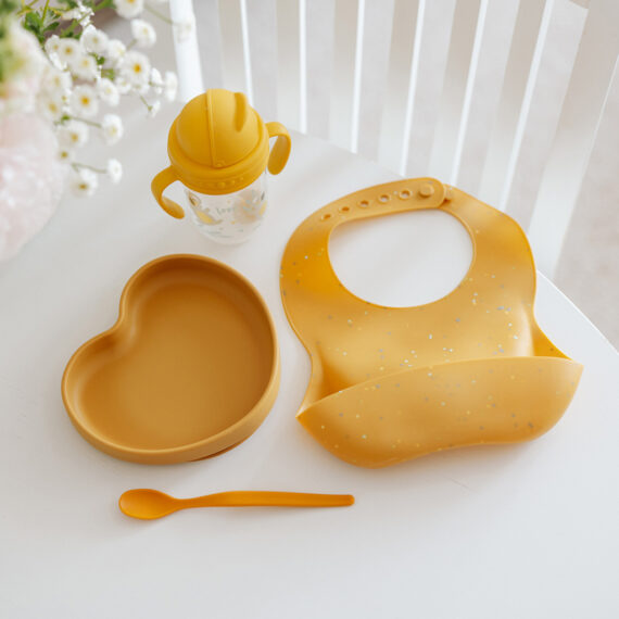 CANPOL BABIES Podbradník silikónový s vreckom Dots - žltý